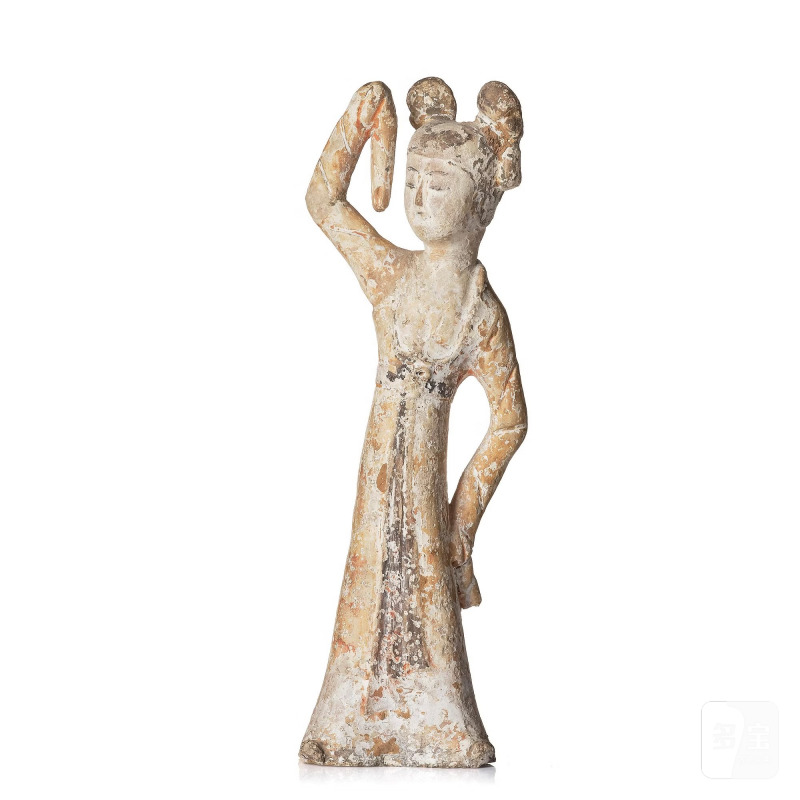 A painted pottery figure of a female dancer,
